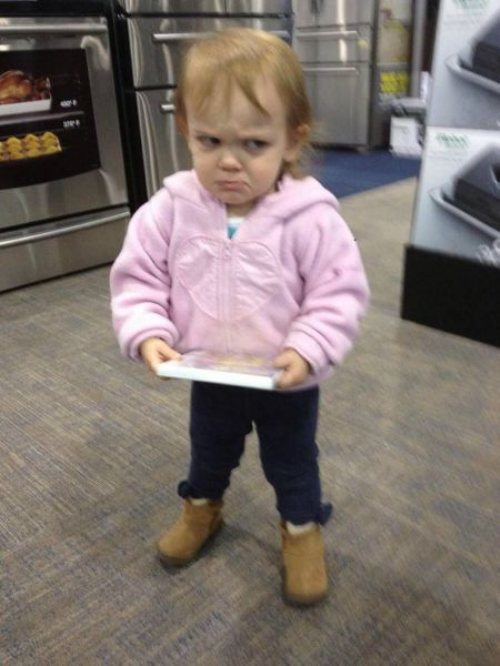 This girl is perfecting her bitter face early.  